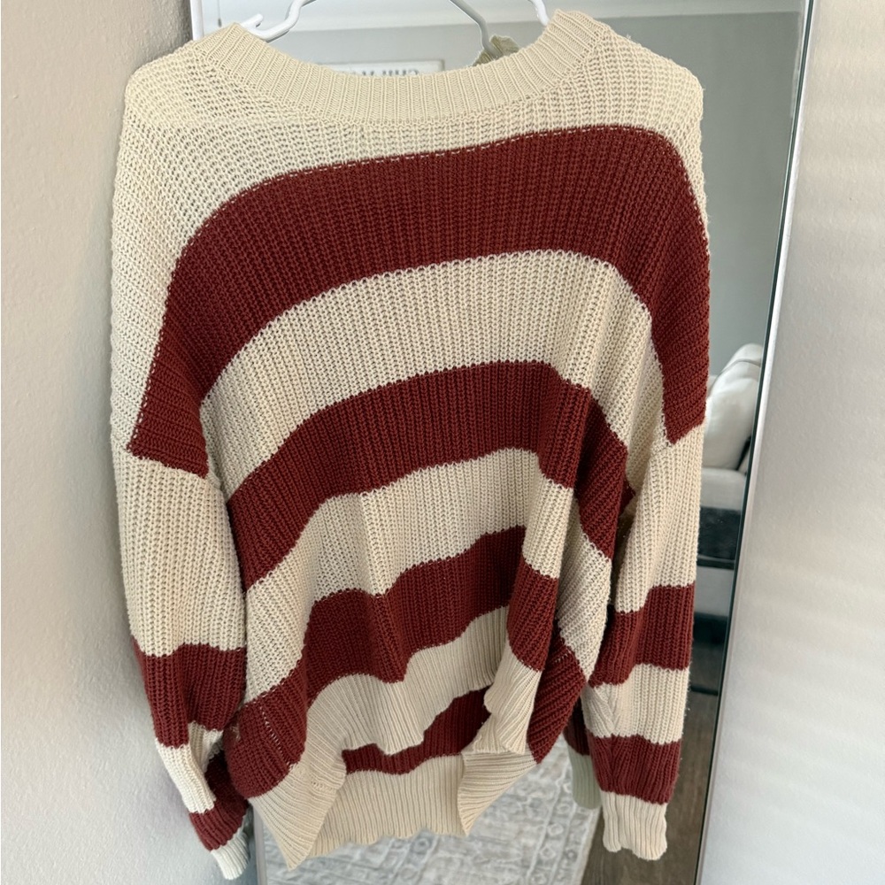 White and red/orange stripped sweater